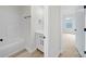 This bathroom features a tub-shower combo, a single sink vanity, and LVP flooring at 4700 Aldersbrook Dr, Monroe, NC 28110