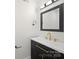 Modern bathroom features sleek vanity, contemporary fixtures and new flooring at 4700 Aldersbrook Dr, Monroe, NC 28110