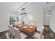 Formal dining room boasts a wood table with seating for six at 4700 Aldersbrook Dr, Monroe, NC 28110