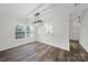 Bright dining area features hardwood floors and a modern light fixture at 4700 Aldersbrook Dr, Monroe, NC 28110