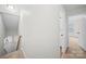 Upstairs hallway with view of a bedroom, fresh paint and neutral carpet at 4700 Aldersbrook Dr, Monroe, NC 28110