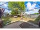 Backyard patio with swing, mature trees and privacy fence at 4700 Aldersbrook Dr, Monroe, NC 28110
