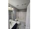 Bathroom featuring a shower-tub combo, a stylish vanity, and marble-look flooring at 5025 Wicklow Dr, Gastonia, NC 28054