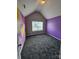 This bright bedroom has gray carpet, a vaulted ceiling and a fun geometric accent wall at 5025 Wicklow Dr, Gastonia, NC 28054