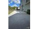 Long driveway leading to the side of the house with a green bin at 5025 Wicklow Dr, Gastonia, NC 28054