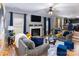 Inviting living room featuring hardwood floors, cozy fireplace, and an abundance of natural light at 5025 Wicklow Dr, Gastonia, NC 28054