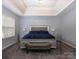 Beautifully staged bedroom with a large window, tray ceiling, and plush gray carpeting at 5025 Wicklow Dr, Gastonia, NC 28054