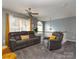 Comfortable second floor sitting area with plush carpeting and abundant natural light at 5025 Wicklow Dr, Gastonia, NC 28054