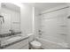 Bathroom with granite counter, bath and shower combo, and neutral flooring at 505 E Robinson St, Dallas, NC 28034