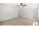 Bedroom with neutral carpet, closet space and ensuite bathroom at 505 E Robinson St, Dallas, NC 28034
