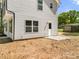 Exterior view of home with vinyl siding and small patio area at 505 E Robinson St, Dallas, NC 28034