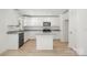 Modern kitchen features white cabinets, granite countertops, stainless steel appliances, and a kitchen island at 505 E Robinson St, Dallas, NC 28034