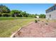 Extensive backyard showcases a well-maintained lawn and decorative landscaping features at 5102 Candleglow Ct, Indian Trail, NC 28079