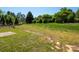 Large backyard features expansive lawn and mature trees, offering a serene outdoor setting at 5102 Candleglow Ct, Indian Trail, NC 28079
