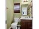 Well-kept bathroom with tiled floors and a vanity with dark wood cabinets at 5102 Candleglow Ct, Indian Trail, NC 28079