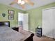 This bedroom includes a ceiling fan, a closet and a double hung window at 5102 Candleglow Ct, Indian Trail, NC 28079