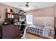 This cozy bedroom has a large bookcase, a window, and is large enough for a home office at 5102 Candleglow Ct, Indian Trail, NC 28079