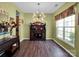 Dining room with hardwood floors, modern lighting, and a large window at 5102 Candleglow Ct, Indian Trail, NC 28079