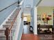 Open foyer with hardwood floors, staircase, and views into the living areas at 5102 Candleglow Ct, Indian Trail, NC 28079