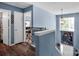 Upstairs hallway features natural light, wood flooring, and neutral paint at 5102 Candleglow Ct, Indian Trail, NC 28079