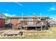 Brick house features backyard patio and deck, set against a blue sky backdrop at 534 Georgia Ave, Statesville, NC 28677