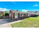 Charming brick single-story home with a well-maintained lawn and a bright blue sky overhead at 534 Georgia Ave, Statesville, NC 28677