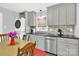 Modern eat-in kitchen with stainless steel appliances and stackable washer and dryer at 534 Georgia Ave, Statesville, NC 28677