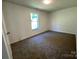 Bright bedroom with plush carpeting and a window for natural light at 6239 Burmith Ave, Charlotte, NC 28269