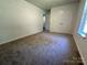 Bedroom with neutral walls, plush carpeting, and closet storage at 6239 Burmith Ave, Charlotte, NC 28269