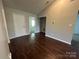 This light-filled bedroom offers ample space and wood floors for a cozy retreat at 6239 Burmith Ave, Charlotte, NC 28269