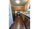 Well-lit kitchen featuring stainless steel appliances, wooden cabinets, and a sleek countertop at 6239 Burmith Ave, Charlotte, NC 28269