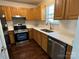 The efficient kitchen features ample counter space, wood cabinets, and modern appliances at 6239 Burmith Ave, Charlotte, NC 28269