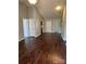 The spacious living room showcases wood floors and multiple entryways for easy flow at 6239 Burmith Ave, Charlotte, NC 28269
