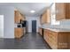 Well-lit kitchen with wooden cabinets, stainless steel appliances, and a large window for ample natural light at 6549 Wesbrook Dr, Charlotte, NC 28214