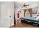 This bedroom features hardwood floors and a ceiling fan at 665 Melbourne Ct, Charlotte, NC 28209