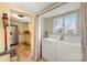 Convenient laundry area adjacent to the kitchen, featuring modern appliances and natural light at 665 Melbourne Ct, Charlotte, NC 28209