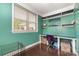 Bright home office with built in shelving, a large window, and hardwood flooring at 665 Melbourne Ct, Charlotte, NC 28209