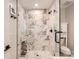Contemporary bathroom with a glass-enclosed shower, marble tile, and modern fixtures at 700 Cooper Dr, Charlotte, NC 28210