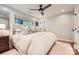 Inviting bedroom with a large window, neutral decor, and soft natural light at 700 Cooper Dr, Charlotte, NC 28210