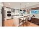 Modern kitchen features quartz countertops, stainless steel appliances, and pendant lighting at 700 Cooper Dr, Charlotte, NC 28210