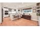 Bright kitchen featuring stainless steel appliances, an island with seating, and hardwood floors at 700 Cooper Dr, Charlotte, NC 28210