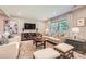 Cozy living room features neutral tones, plush seating, and lots of natural light at 700 Cooper Dr, Charlotte, NC 28210