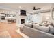 Cozy living room with a brick fireplace, hardwood floors, and a sliding barn door to the side at 700 Cooper Dr, Charlotte, NC 28210