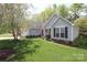 Beautiful single-story home showcasing well-kept lawn and landscaping with a detached garage at 7515 Shadowstone Dr, Charlotte, NC 28270