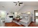 Comfortable living room with a fireplace, a ceiling fan and ample seating at 7515 Shadowstone Dr, Charlotte, NC 28270