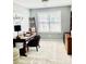 Office features a desk, chair, decorative ladder, and a bright window, creating a cozy workspace at 7515 Shadowstone Dr, Charlotte, NC 28270