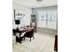 Office with a desk, chair, shelving, and a large window, providing ample natural light at 7515 Shadowstone Dr, Charlotte, NC 28270