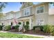 Inviting two-story townhouse with a cozy porch and well-maintained landscaping at 7910 Camden Hollow Rd, Huntersville, NC 28078