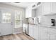 Modern white kitchen with stainless steel appliances and plenty of counter space at 7910 Camden Hollow Rd, Huntersville, NC 28078