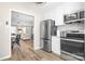 Well-equipped kitchen with stainless steel refrigerator and an open view to the living area at 7910 Camden Hollow Rd, Huntersville, NC 28078